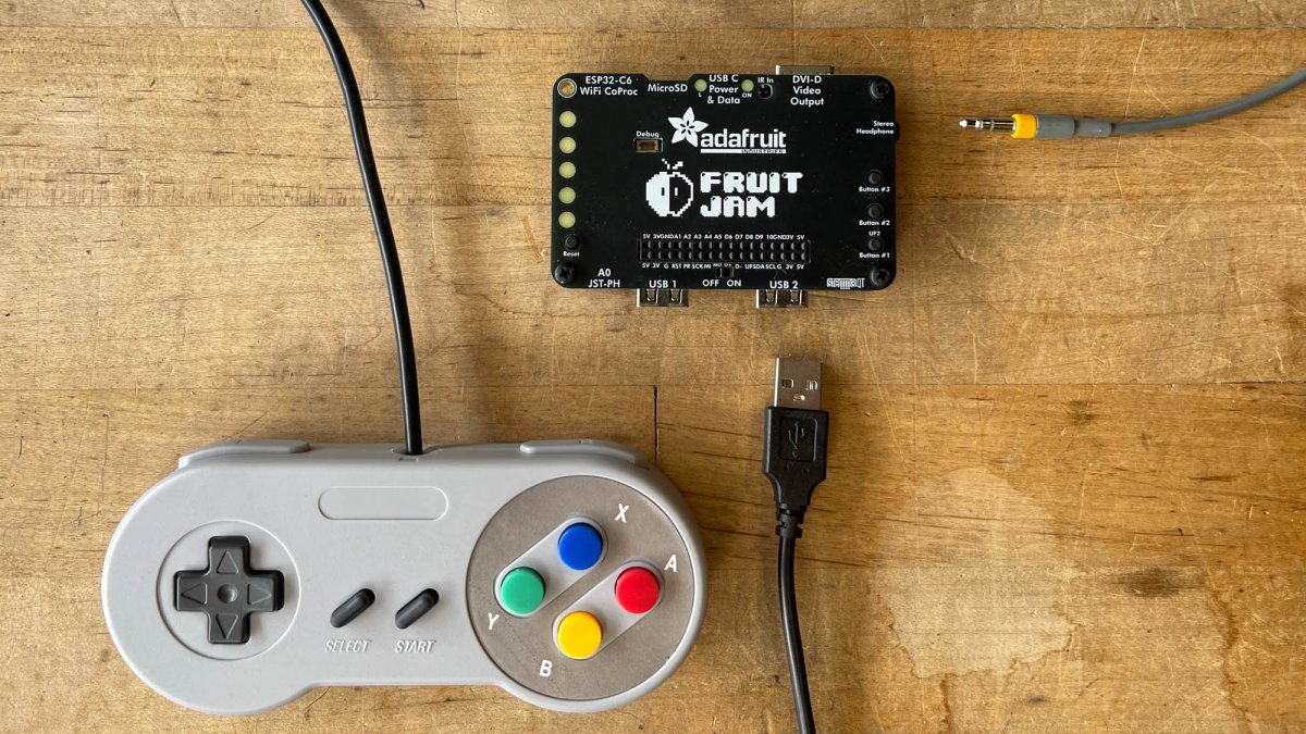 Spa-projekt-Fruit-Jam-Mini-Rechner-im-Kreditkartenformat-als-NES-Konsole