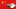 Zahnräder mit Sternen in Deutschland-Farben vor Chinesischer Flagge