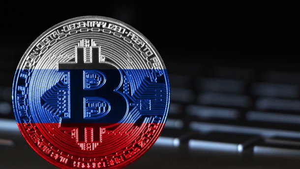 Bitcoin,Close-up,On,Keyboard,Background,,The,Flag,Of,Russia,Is