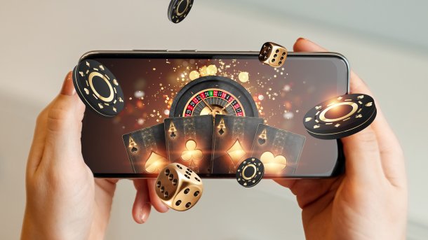 Creative,Background,,Online,Casino,,In,A,Man's,Hand,A,Smartphone