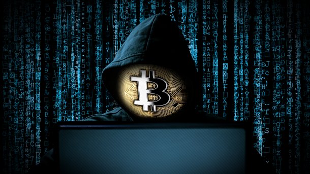 Hacker,With,Bitcoin,Face,Mask,Behind,Notebook,Laptop,In,Front,Crypto,Kryptowährung