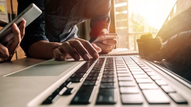 Two people on a laptop