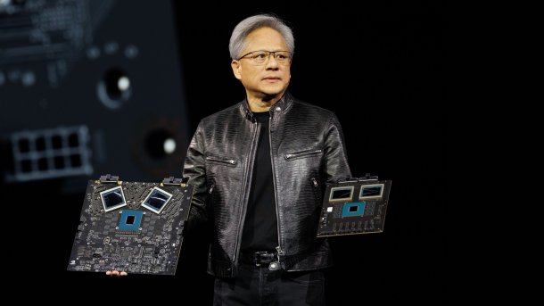 Nvidia boss Jensen Huang with AI hardware in his hands