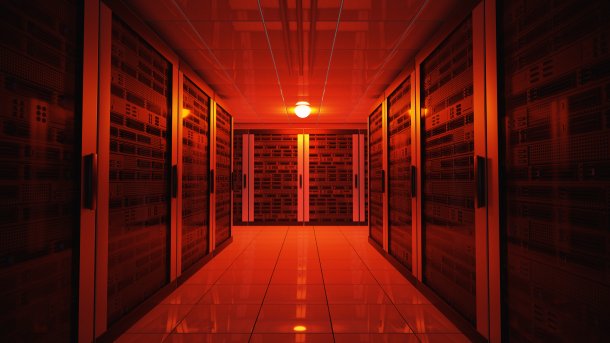 Ominous red-lit corridor between server cabinets
