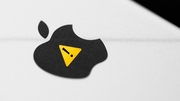 Apple logo on the back of a device with a warning symbol