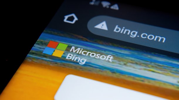 Bing.com in the address bar of a smartphone browser, including a logo for Microsoft Bing