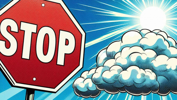 Stop sign in front of a cloud