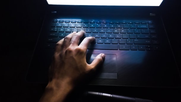 Hand taps on keyboard