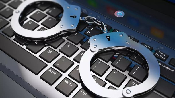 Handcuffs on a keyboard