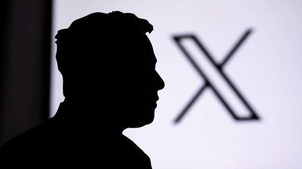 Silhouette of Elon Musk in front of the X logo