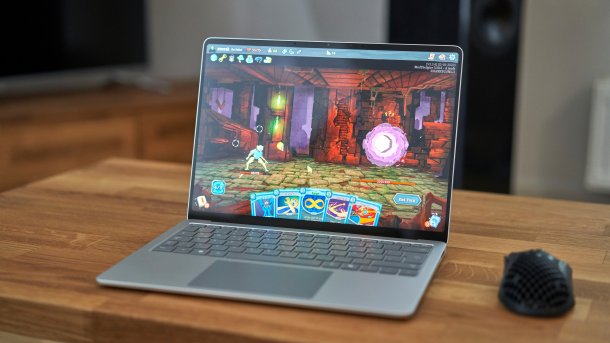 Notebook with the game Slay the Spire on a table