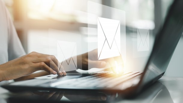 Person typing on laptop.