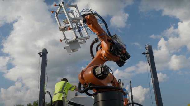 Robot arm on a construction vehicle