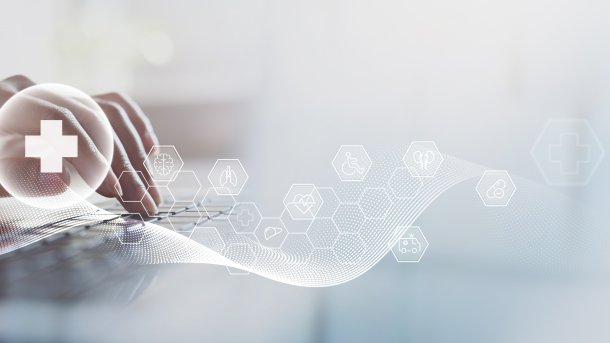 Person at a keyboard, surrounded by symbols relating to the topic of health.