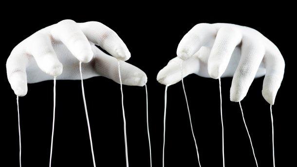 Hands with cords hanging from them