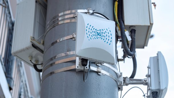 Detail of a mobile phone antenna mast with small 5G radio cells.