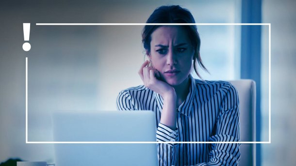 Woman in front of a computer wonders.