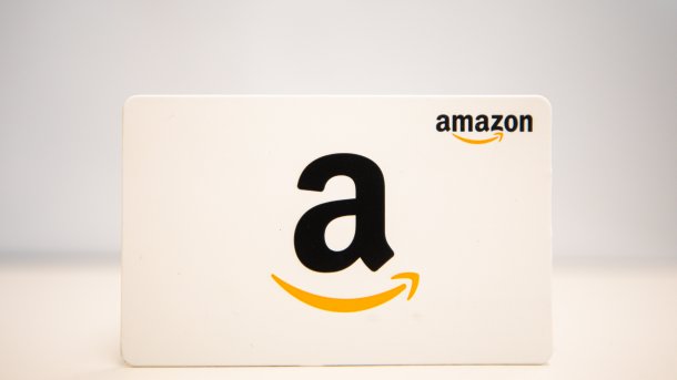 The Amazon logo on a white sign against a white background.
