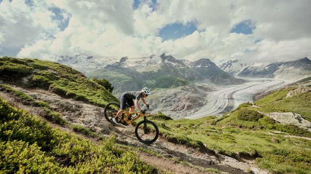 Mountain biker rides down a mountain