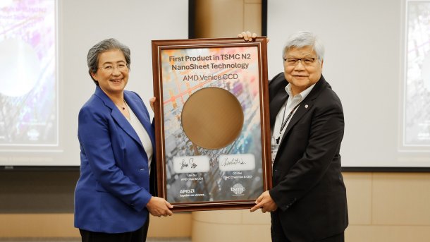 AMD's Lisa Su and TSMC's C. C. Wei hold up a wafer together