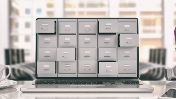 An open laptop with symbolic drawers on the display.