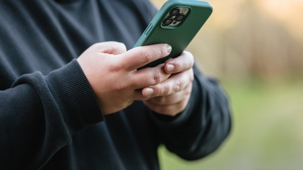 Overweight man on smartphone