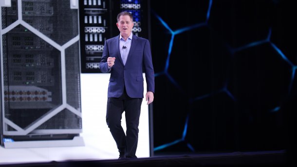 Michael Dell on a stage, servers behind him