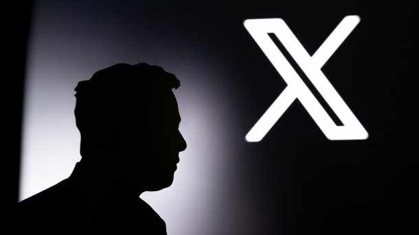 Silhouette of Elon Musk in front of the X logo