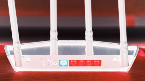 Inverted and red colored image of a router from behind