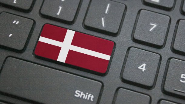 Close-up of a keyboard, one key in the colors of the Danish flag