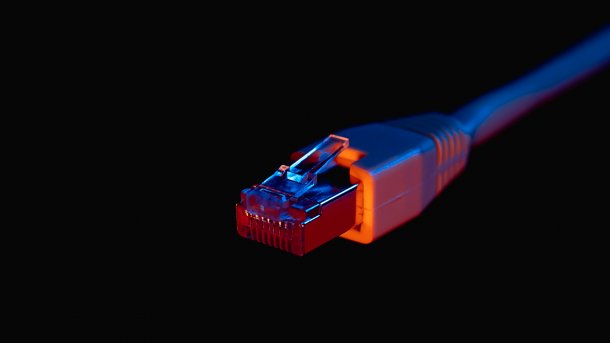 Ethernet plug against a black background