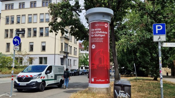 The first 5G advertising column in Stuttgart with red Vodafone advertising.