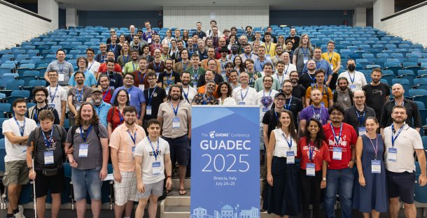 Group photo from GUADEC, over 100 participants in a lecture hall