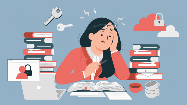Woman sits in front of books and laptop
