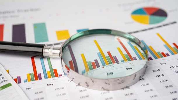 Magnifying,Glass,On,Charts,Graphs,Paper.,Financial,Development,,Banking,Account,