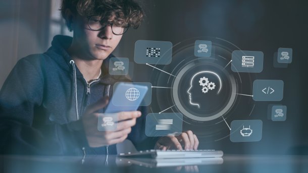Boy with smartphone in front of several virtual displays
