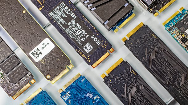 Several M.2 SSDs are positioned diagonally next to each other