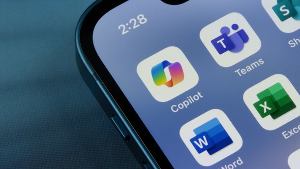 Microsoft Copilot app icon is seen among other Microsoft 365 apps on an iPhone.