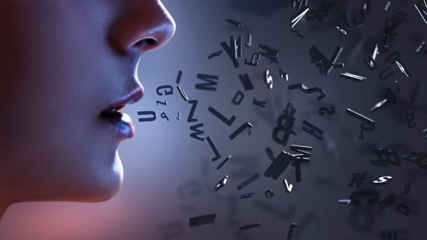 Profile of a woman with letters in front of her mouth