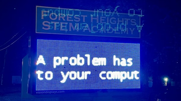 Matrix display shows "A problem has to your comput" in a night-time environment
