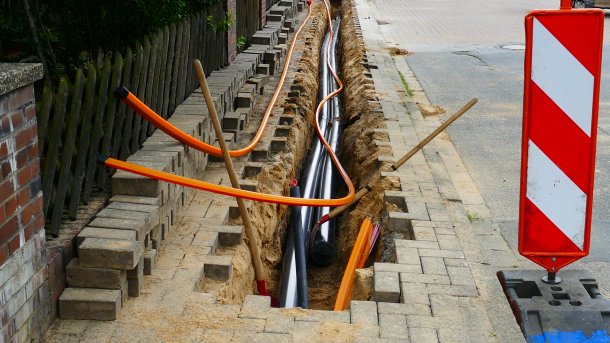 Open sidewalk with fiber optic cable inside