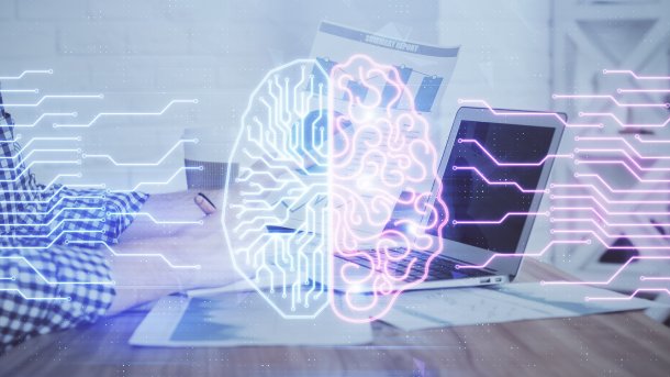 Hologram of a brain in front of a laptop