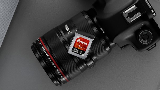 Memory card is placed on the lens of a camera