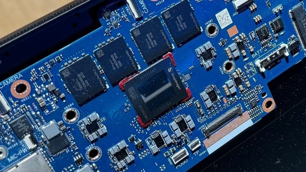 Bare processor and RAM on a blue board