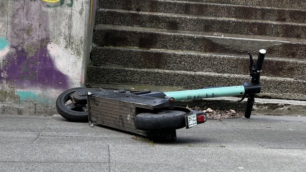 overturned kick scooter in front of stairs