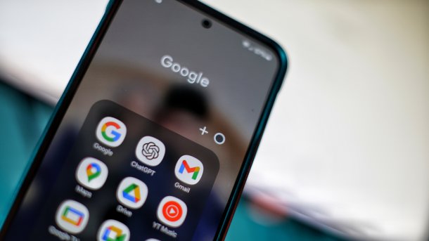 Smartphone screen with many Google apps and the ChatGPT app logo in between