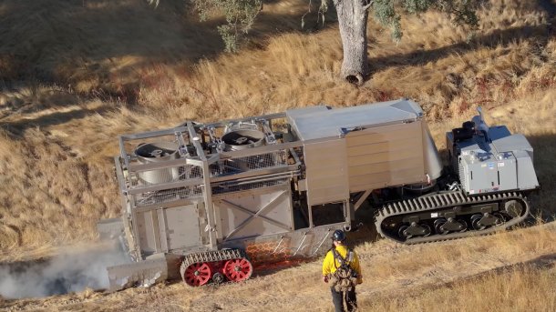 BurnBot drives over grass and burns a swathe.