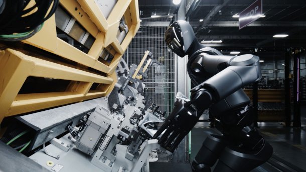 Humanoid robot Figure 02 at a welding machine.