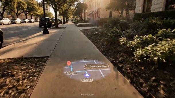 Blick durch Smart Glasses auf einen Gehweg, darunter eine digital eingeblendete AR-Navigation.