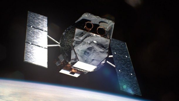 A space probe, with Earth in the background